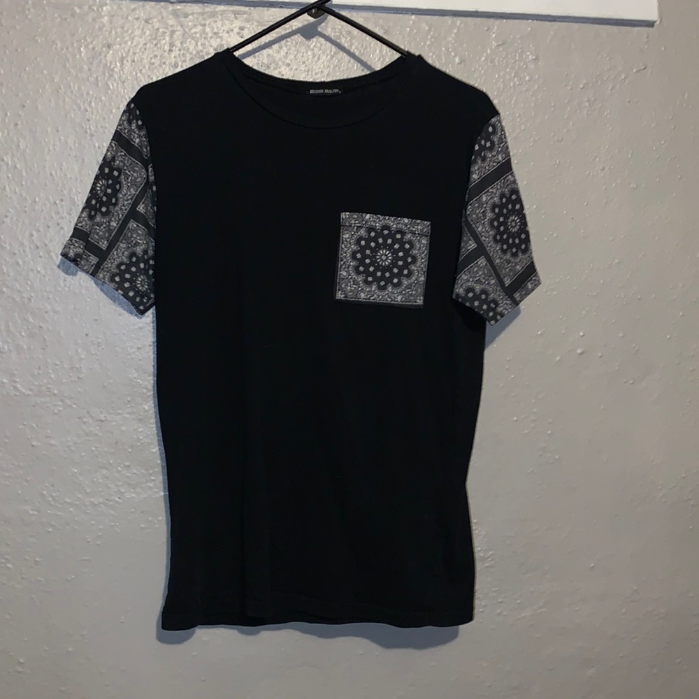 Broken English t shirt with fun paisley print on sleeves and pocket!